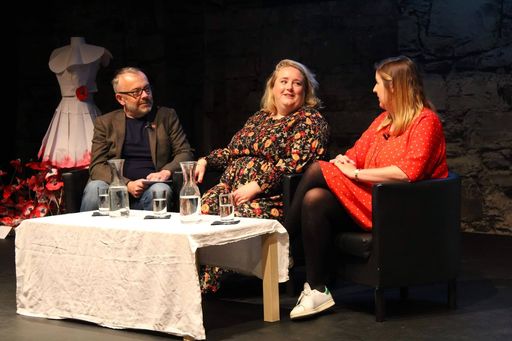 Rick O'Shea interviews Authors of Oh My God, What a Complete Aisling series Sarah Breen and Emer McLysaght at Dublin Book Festival 2019. Image is of three individuals in discussion while seated at a table on a stage.